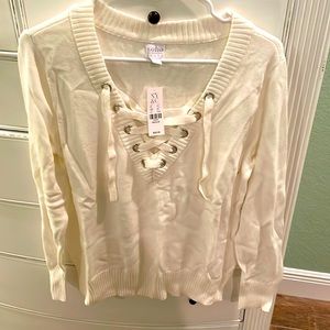 Brand new with tags super cute Criss cross detailed sweater top!